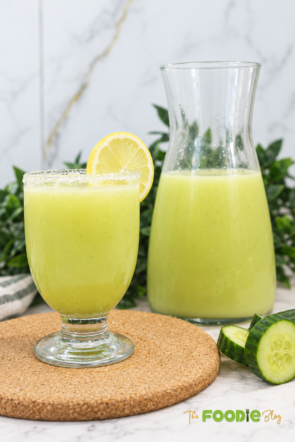Ingredients for cucumber lemonade including cucumber, water, lemon juice, mint, lemon zest, plain yogurt, and honey.
