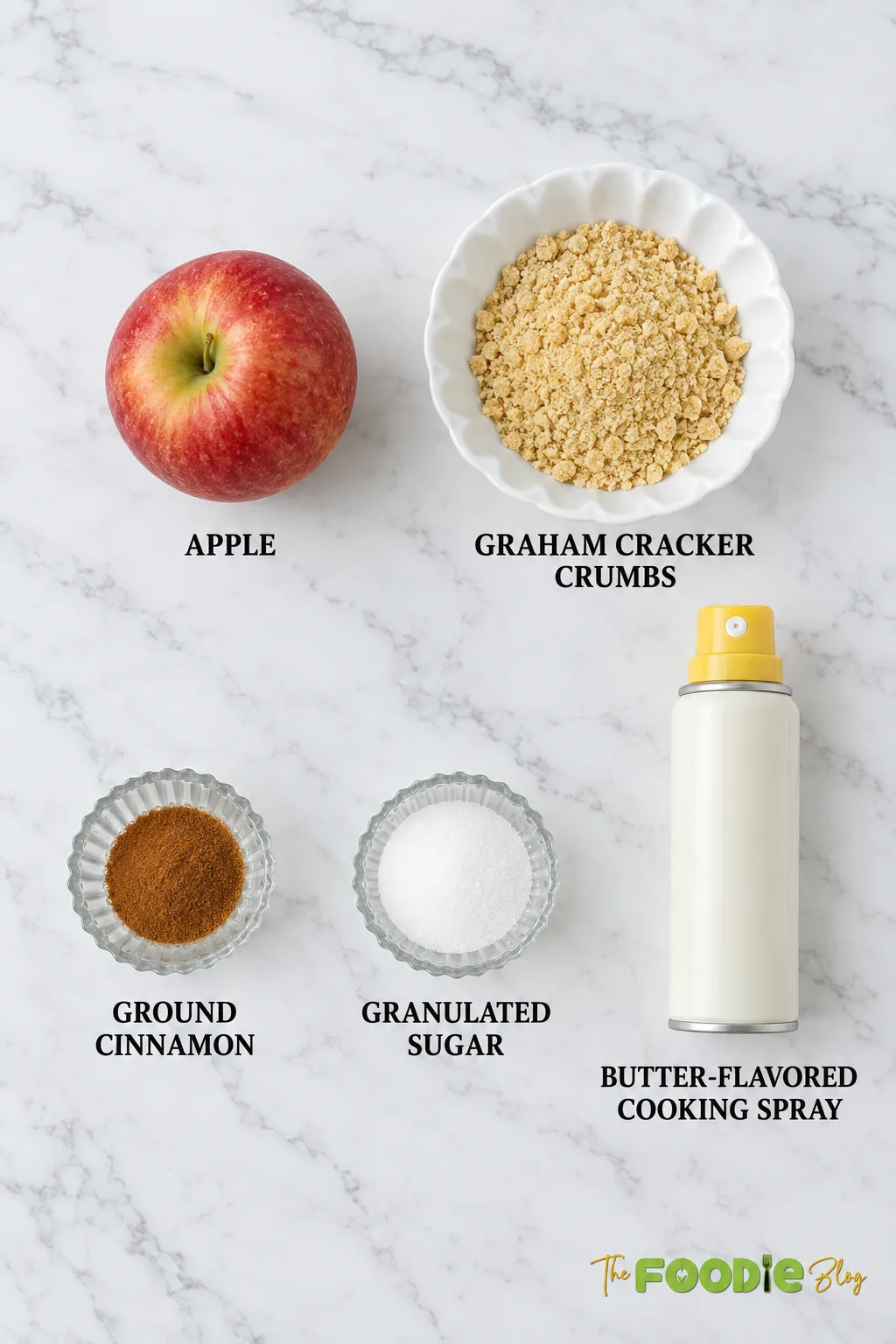 Air fryer apple fries ingredients including apple, graham cracker crumbs, cinnamon, sugar, and butter-flavored cooking spray.