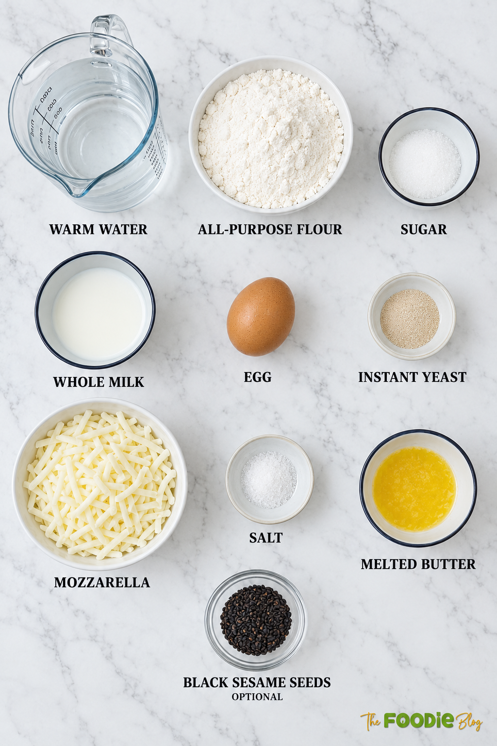 Ingredients for cheese naan including flour, warm water, milk, egg, yeast, sugar, mozzarella, butter, salt, and black sesame seeds.