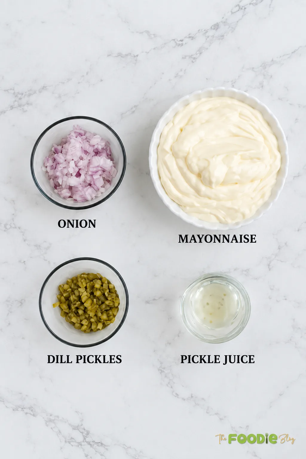 Tartar sauce ingredients including mayonnaise, onion, dill pickles, and pickle juice