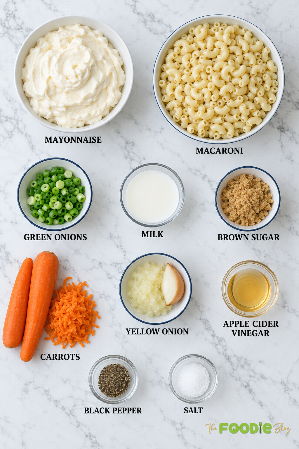 Ingredients for Hawaiian macaroni salad including macaroni, mayonnaise, carrots, onions, milk, brown sugar, and apple cider vinegar.
