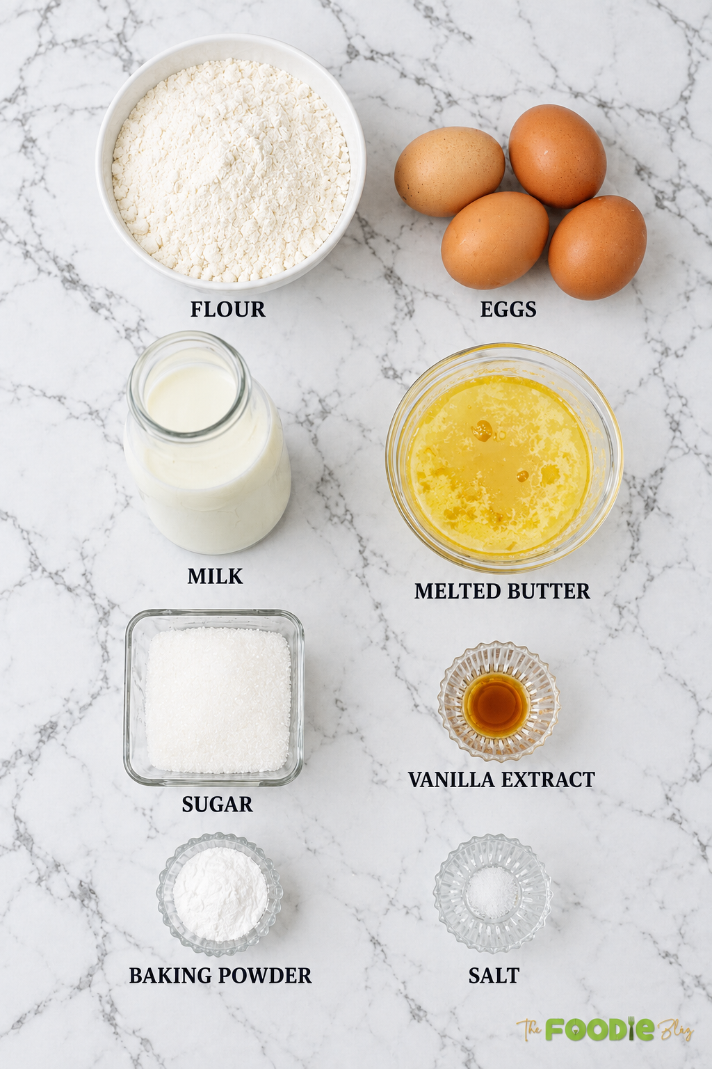 Homemade waffle ingredients including flour, eggs, milk, melted butter, sugar, vanilla, baking powder, and salt