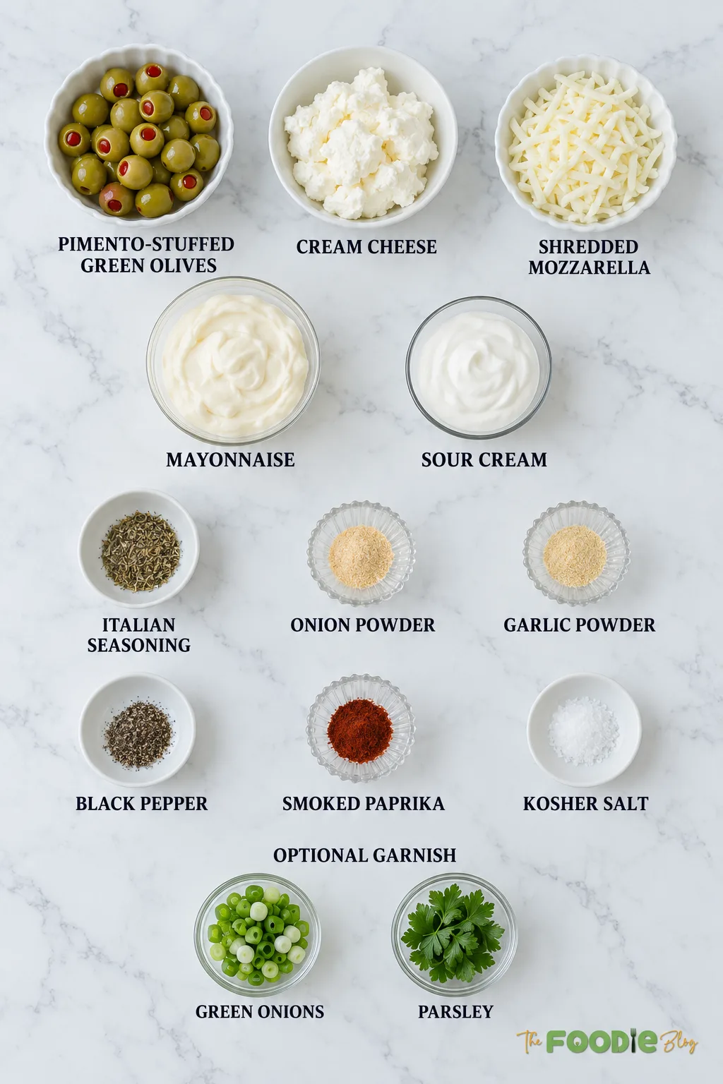 Green olive dip ingredients including olives, cream cheese, mozzarella, mayonnaise, sour cream, and seasonings.