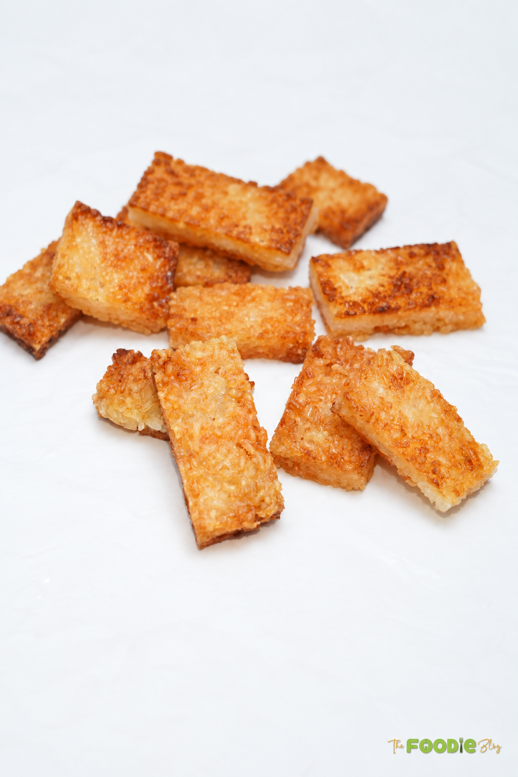 Freshly fried crispy rice rectangles with golden brown crunchy surfaces.