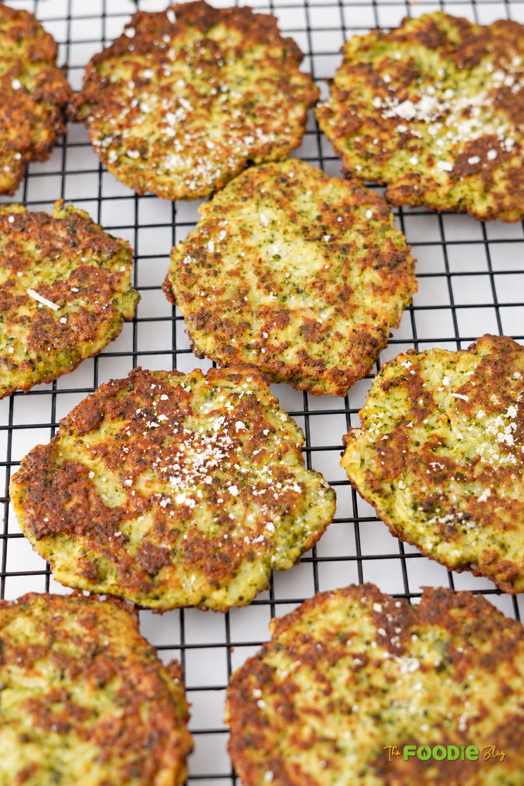 Crispy Parmesan broccoli fritters served golden brown on a cooling rack.