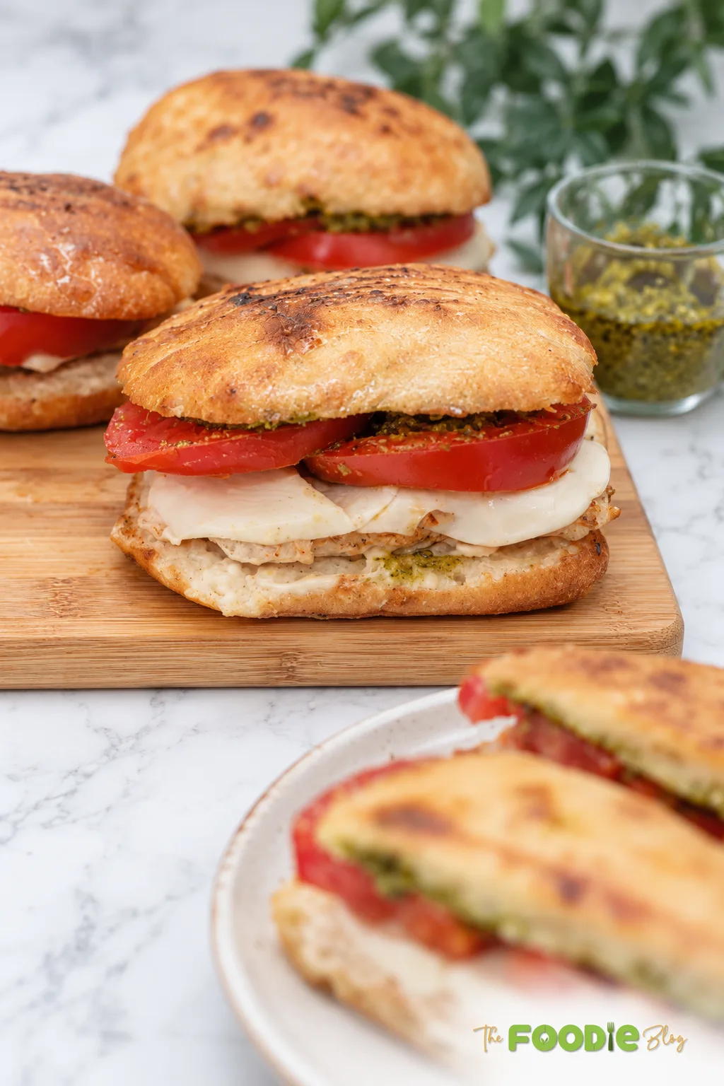 Easy chicken pesto sandwich with mozzarella and tomato on toasted ciabatta