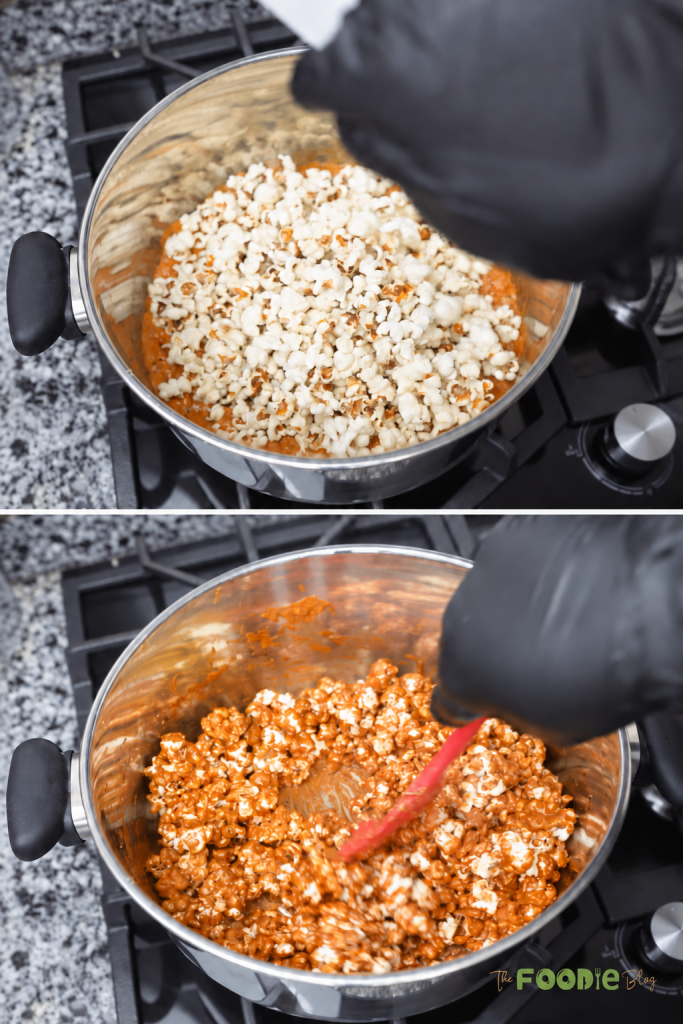 Freshly popped popcorn being stirred into warm homemade caramel sauce.