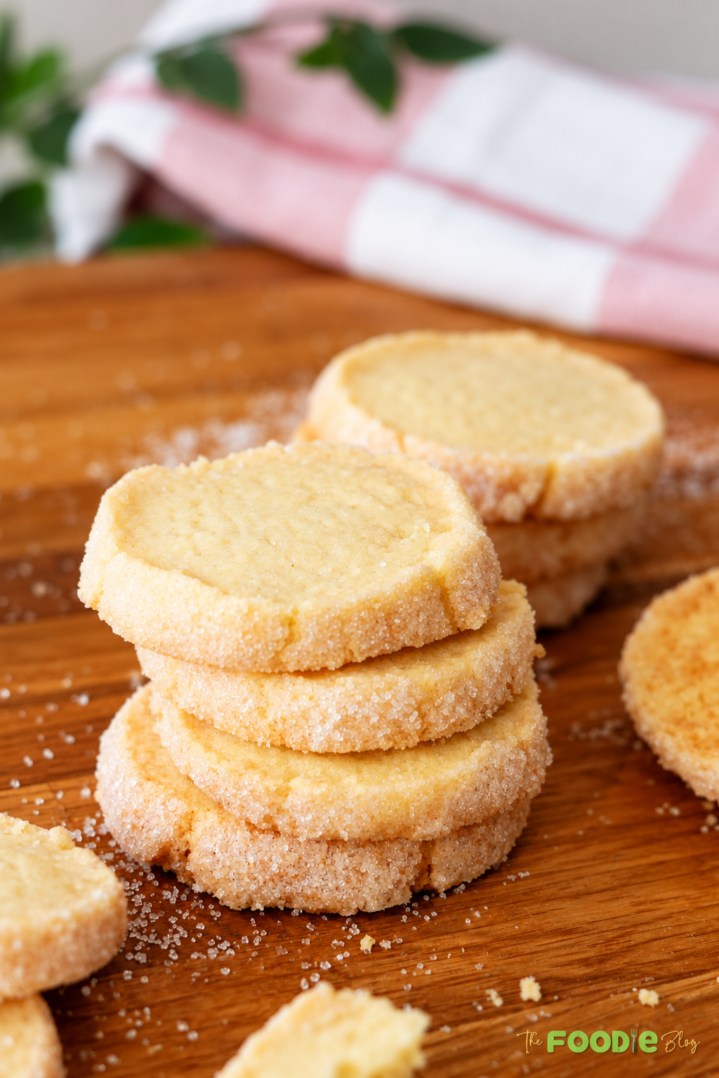 Close-up of buttery French sablé cookies with crisp sugar-coated edges and tender centers.