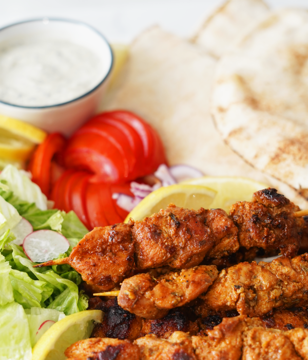 charcoal chicken shop chicken skewers in pita with salad and sauce